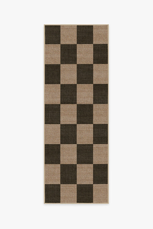 Checkered rug with brown and black squares on a white background