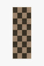 Checkered rug with brown and black squares on a white background