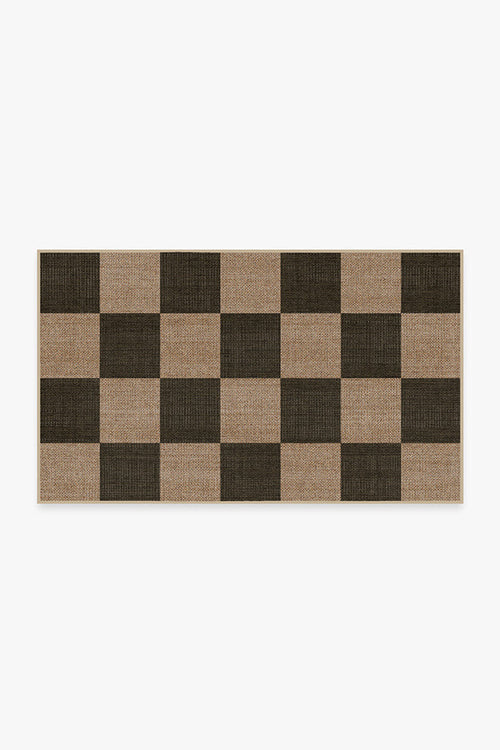 Checkered rug with brown and beige squares on a white background