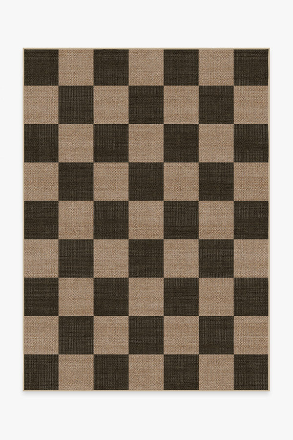 Checkered rug with brown and beige squares on a white background