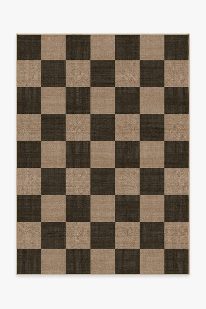 Checkered rug with brown and beige squares on a white background