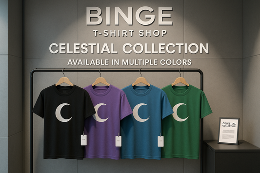 Collection of t-shirts in different colors (black, purple, blue, and green) with crescent moon designs displayed on a clothing rack in a modern boutique setting with Binge T-shirt Shop signage and text "Celestial Collection" and "Available in Multiple Colors"