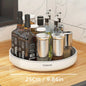 A 360-degree rotating white kitchen organizer with a selection of bottles and containers on a circular base, placed on a kitchen counter.