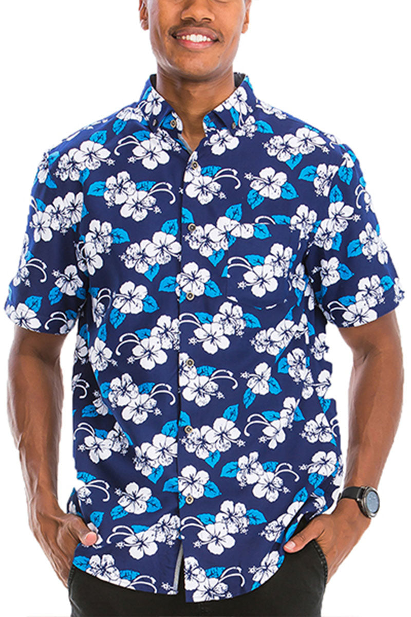 Man wearing a navy blue shirt with white and blue floral pattern on a white background