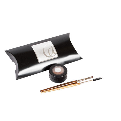 Eyebrow grooming kit with pencil and brush on a white background