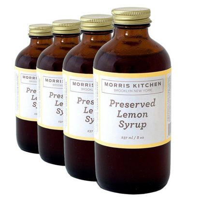 Four bottles of Morris Kitchen Preserved Lemon Syrup, each labeled 8oz.