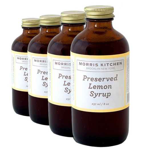 Four bottles of Morris Kitchen Preserved Lemon Syrup, each labeled 8oz.