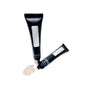 Two black cosmetic tubes with white labels on a white background