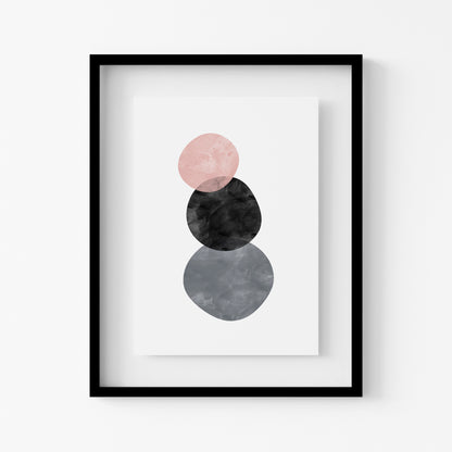 Framed abstract art print with pink, black, and gray circles on a white background