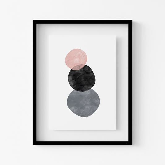 Framed abstract art print with pink, black, and gray circles on a white background