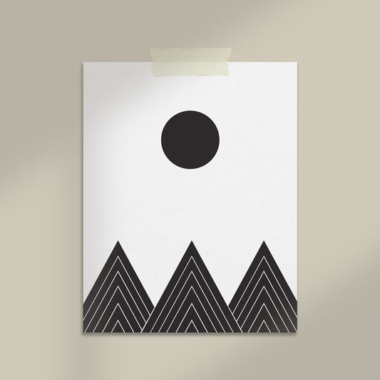 Geometric design with black circle and triangles on a white background, mounted on a beige wall.