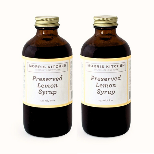 Two bottles of Morris Kitchen Preserved Lemon Syrup, each labeled 8oz.