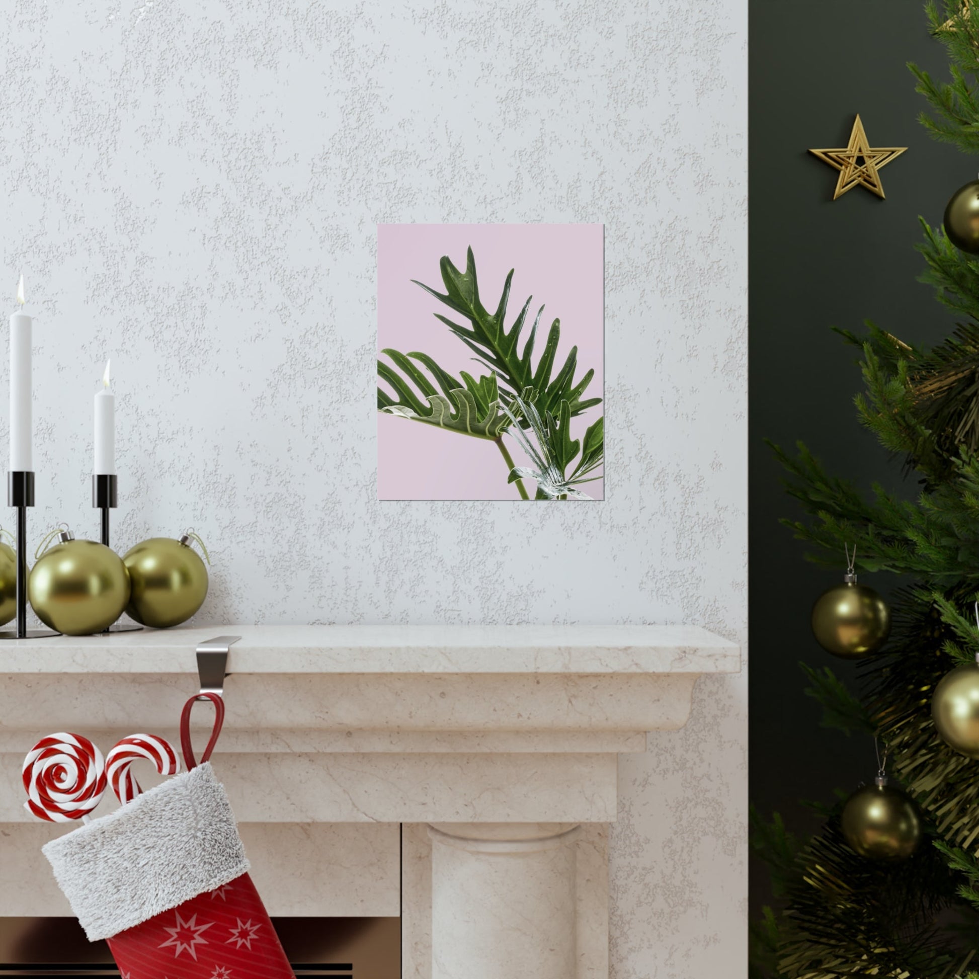 Decorative scene with a Christmas tree, stockings, and a wall art piece.