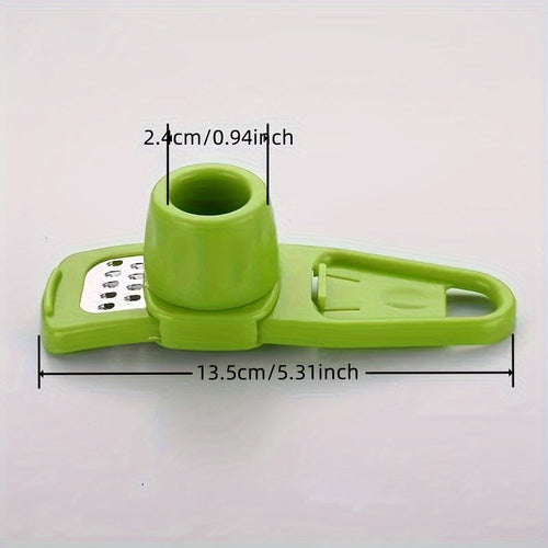 A green Compact MultiFunction Garlic Grinder Press being used to mince garlic, with the device disassembled to show the inner mechanism.