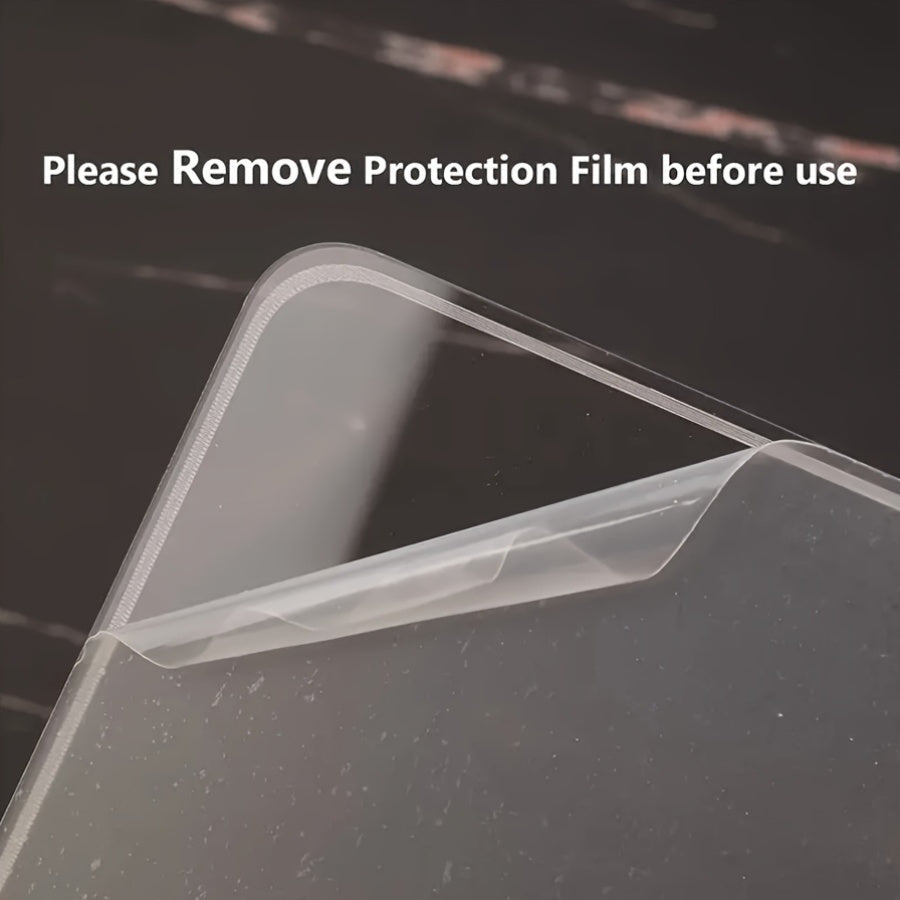 Clear protective film on a laptop screen with text 'Please Remove Protection Film before use'.