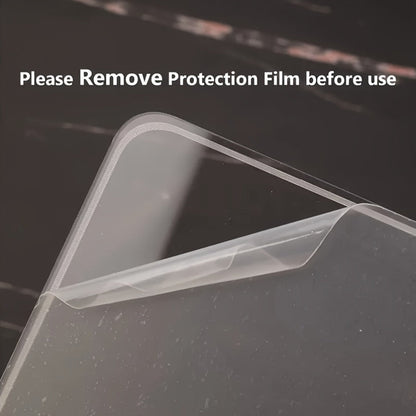 Clear protective film on a laptop screen with text 'Please Remove Protection Film before use'.
