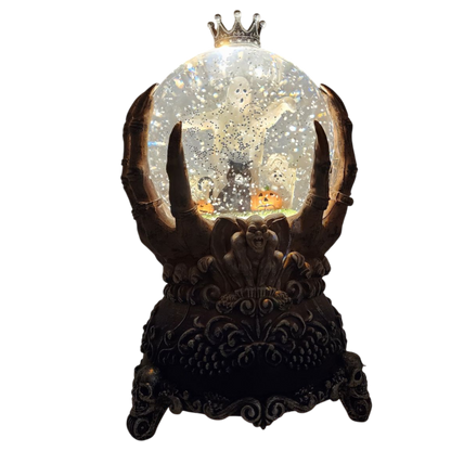 Spooky Spinning Waterglobe held by Skeleton Hands