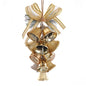 Decorative gold bell ornament with a bow on a white background