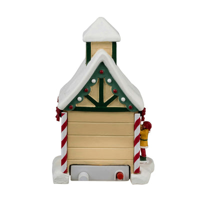 Decorative Christmas toy resembling a small building with candy cane elements on a white background