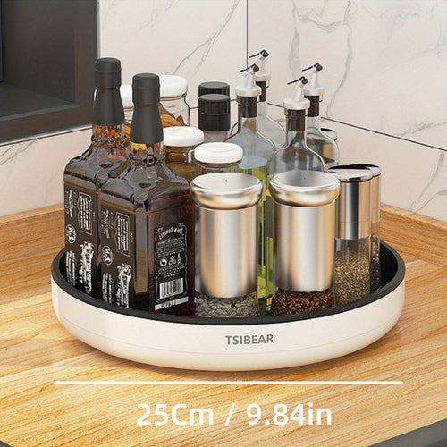 A 360-degree rotating white kitchen organizer with a selection of bottles and containers on a circular base, placed on a kitchen counter.
