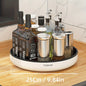 A 360-degree rotating white kitchen organizer with a selection of bottles and containers on a circular base, placed on a kitchen counter.