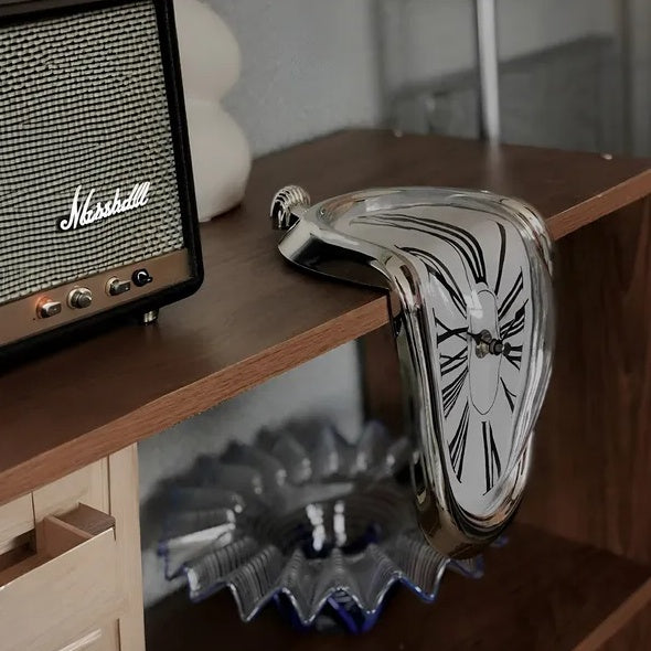 Vintage-style clock on a wooden shelf with a Marshall amplifier in the background