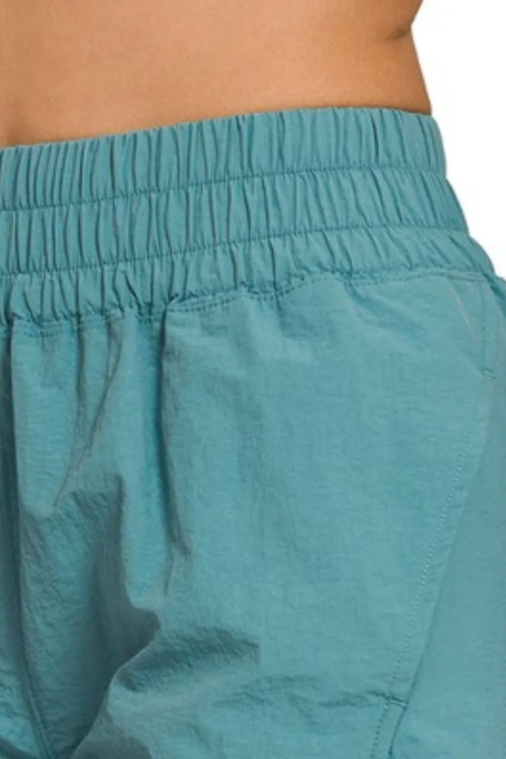 Zenana Windbreaker Smocked Waistband Running Shorts in Teal