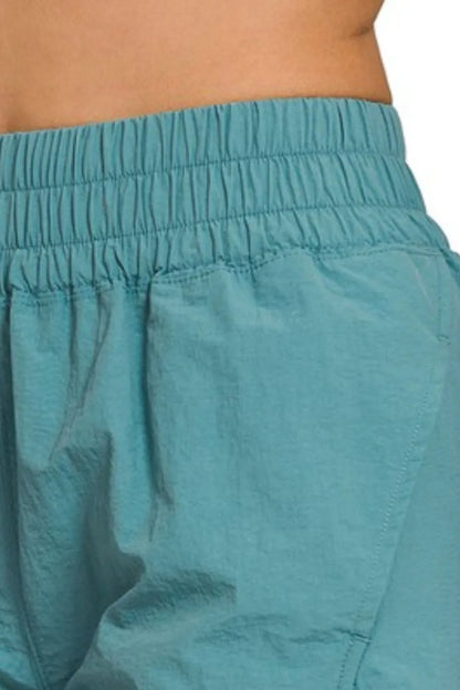 Zenana Windbreaker Smocked Waistband Running Shorts in Teal