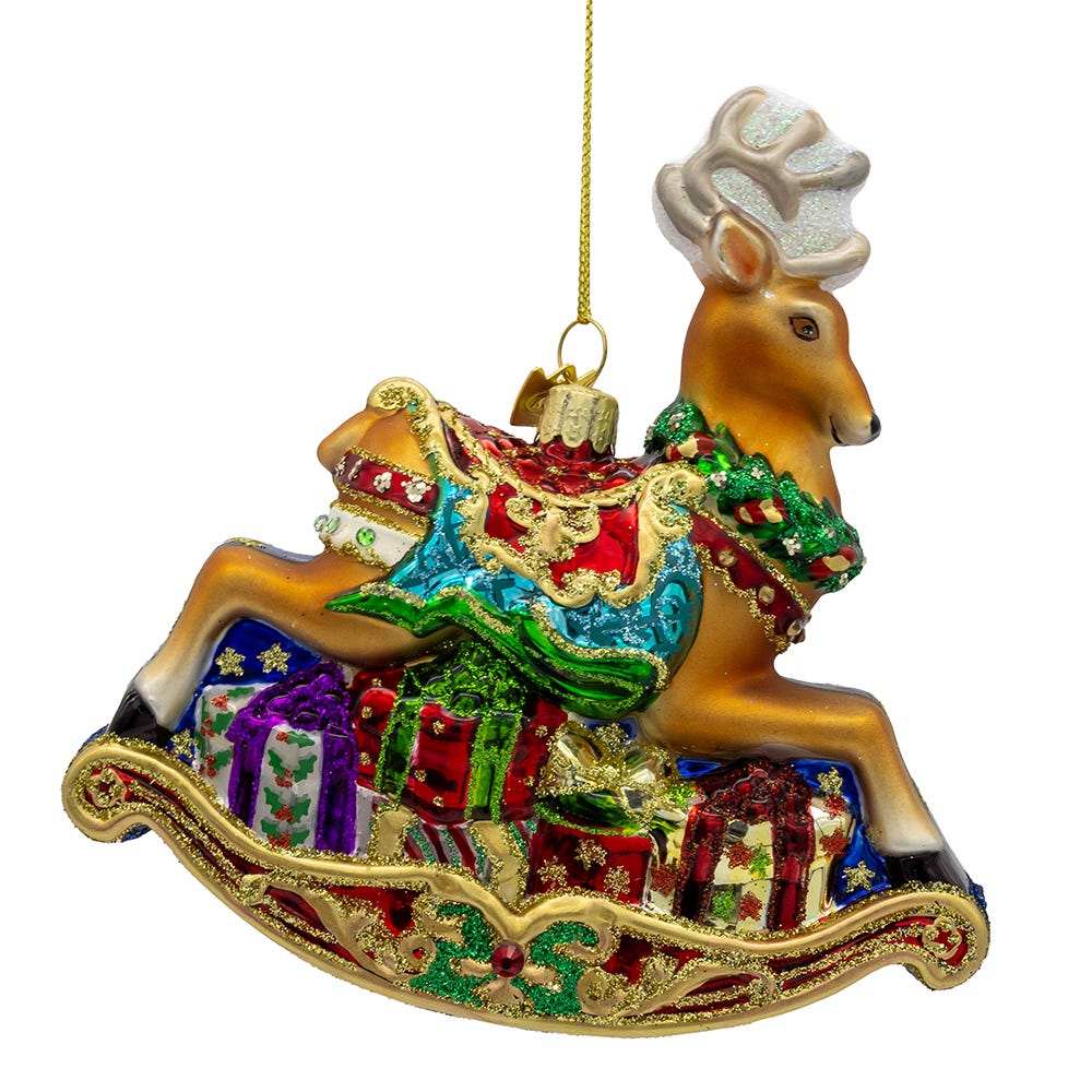 Decorative Christmas ornament of a reindeer with a sleigh full of presents on a white background.