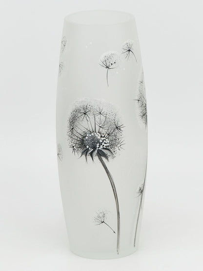Ceramic vase with black floral design on a white background
