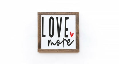Framed artwork with 'LOVE more' text on a white background