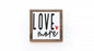 Framed artwork with 'LOVE more' text on a white background