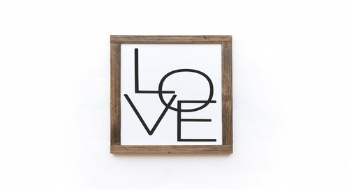 Framed artwork with 'LOVE' text on a white background