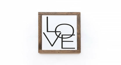 Framed artwork with 'LOVE' text on a white background