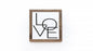 Framed artwork with 'LOVE' text on a white background