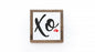 Framed artwork with 'Xo' and a heart on a white background