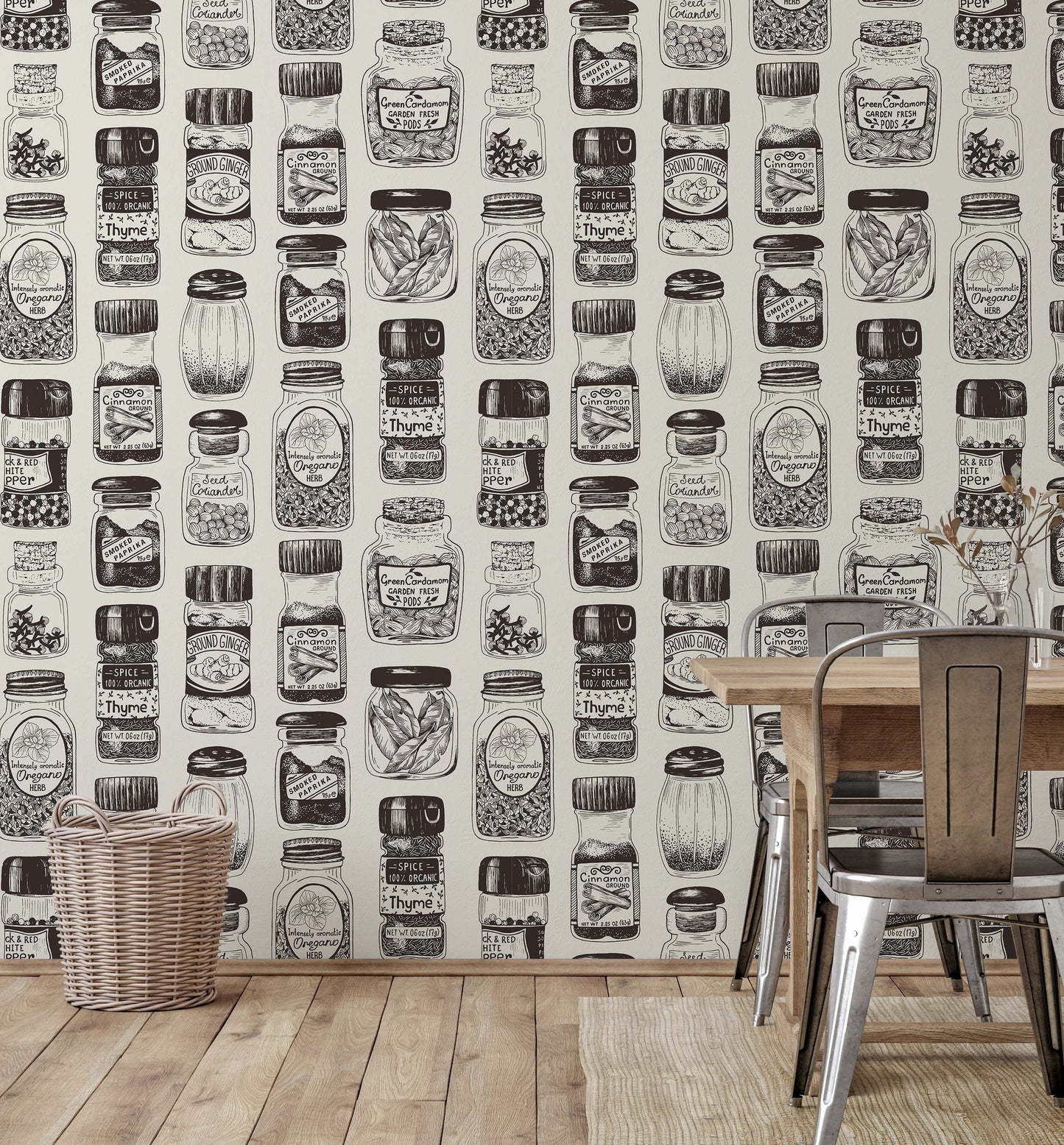 A section of wallpaper with a vintage spice rack design, featuring black and white illustrations of various herbs and spices, displayed in a room setting with a table and chairs.
