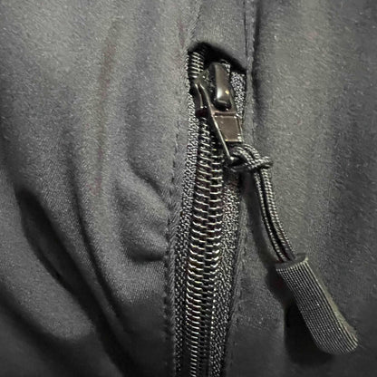 Close-up of a zipper on a gray fabric background