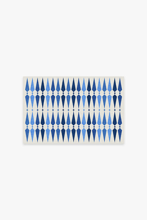 Rectangular placemat with blue geometric pattern on a white background