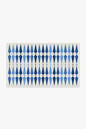 Rectangular mat with blue geometric pattern on a white background