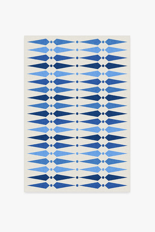 Rug with blue geometric pattern on a white background