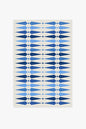 Rug with blue geometric pattern on a white background