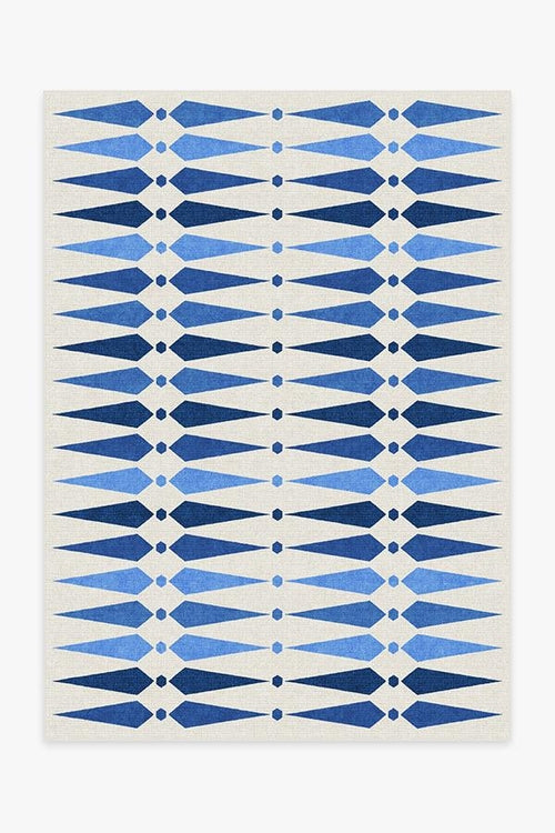 Rug with blue geometric pattern on a white background