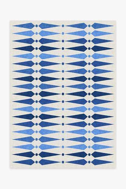 Rug with blue geometric pattern on a white background