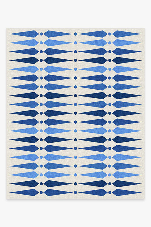 Rug with blue geometric pattern on a white background