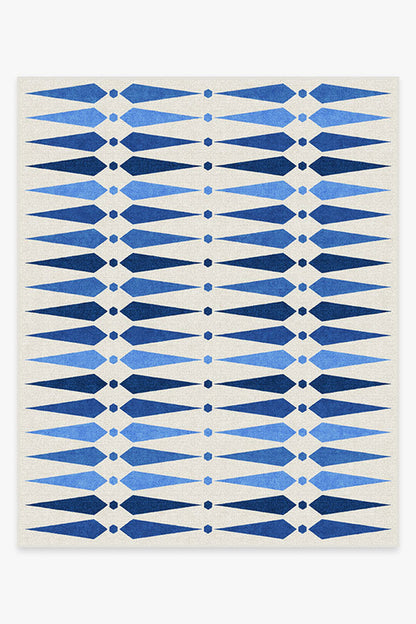 Rug with blue geometric pattern on a white background