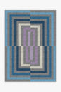 Geometric patterned rug with blue, gray, and purple colors on a white background