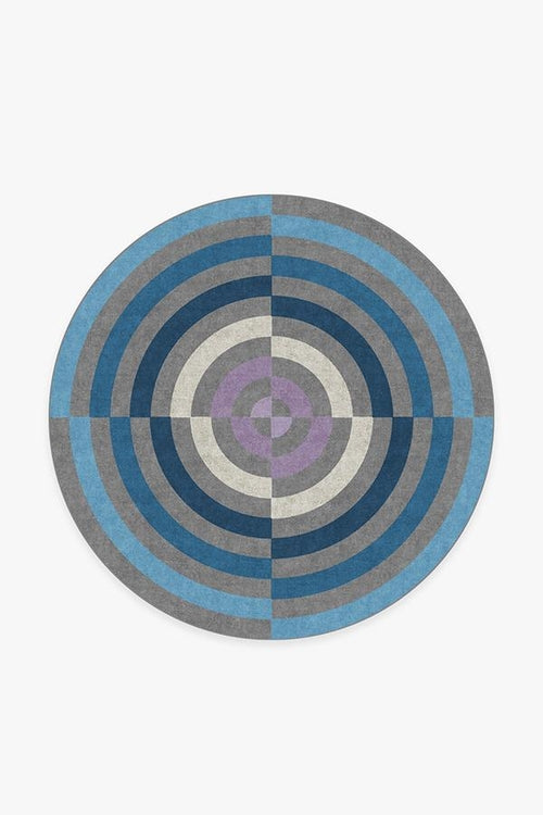 Round rug with concentric circle pattern on a white background