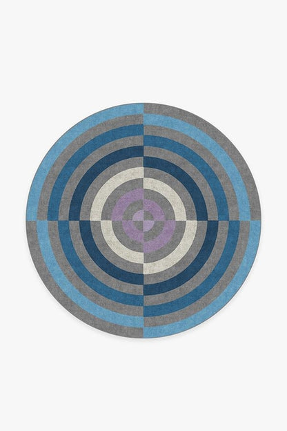 Round rug with concentric circle pattern on a white background