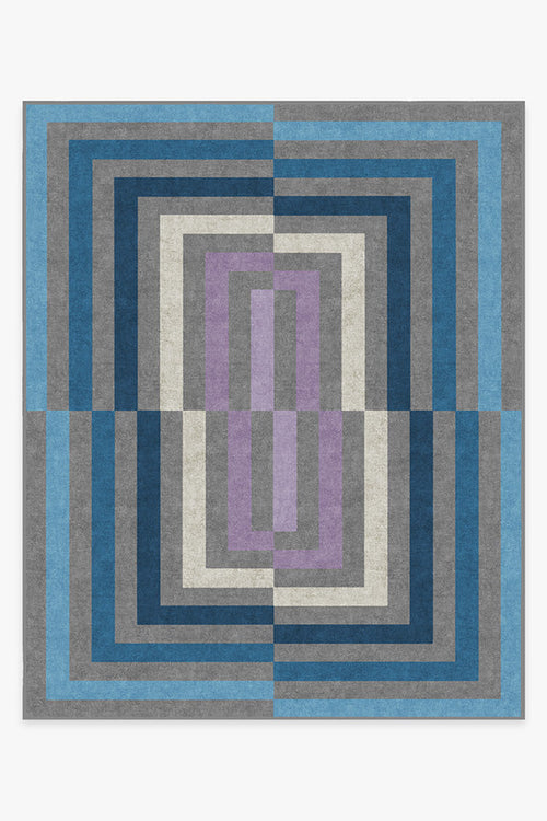 Geometric patterned rug with blue, gray, and purple colors on a white background